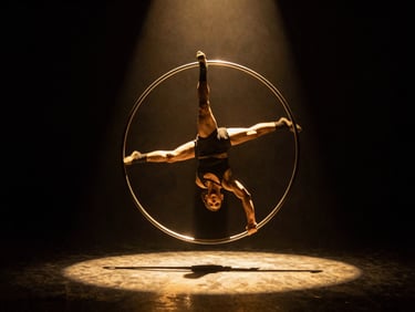 Cinematic performance photography of a Cyr Wheel artist spinning under a single dramatic golden spotlight, deep obsidian shadows, high-contrast rim lighting, 35mm.