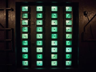 Abstract architectural lines of a secure data vault, imposing, high-contrast, terminal green light, deep shadows, 35mm