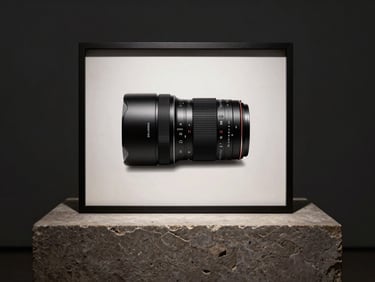 Symmetrical, museum-quality gallery framing of a sleek hardware device resting on a heavy stone plinth, deep shadows.
