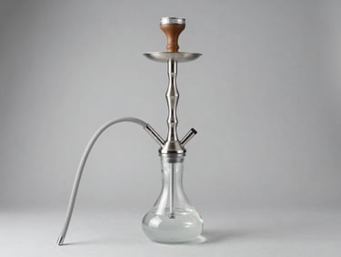 Premium modern glass hookah with stainless steel shaft, directional side-lighting, neutral gray backdrop