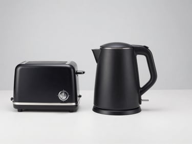 Modern electric kettle and toaster set in matte black finish on a clean studio background
