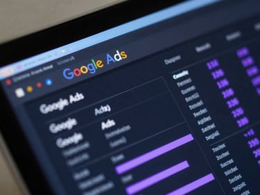 Macro close-up of a dark Google Ads dashboard interface with glowing purple metrics, sharp directional light blue rim lighting on a glass screen.