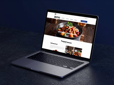 Sleek modern laptop mockup on a dark stone desk, displaying a high-contrast restaurant menu website, deep midnight blue studio lighting, glowing glassmorphism details