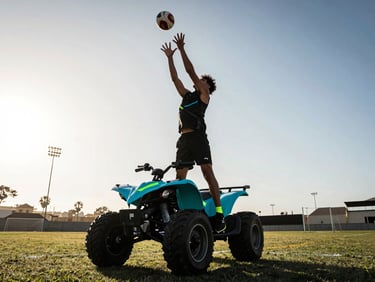 Dynamic low-angle sports photography of a quadball player leaping to catch a ball, dramatic late-afternoon sun over a sports field in Lima, high-contrast, neon cyan accents
