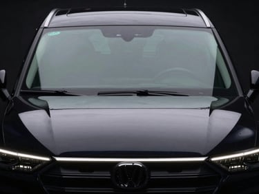 Low-angle heroic car portrait, front windows with a very light ceramic tint, sharp LED reflections, deep glossy paint, dark low-key automotive photography, 50mm