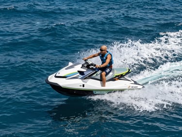 Pristine modern jet ski cutting through deep blue Red Sea water, dynamic action shot, bright high-contrast sunlight, sharp focus, premium editorial, 35mm