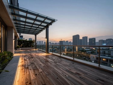 Cinematic wide-angle architectural photograph of a modern luxury penthouse terrace garden at twilight, warm structural uplighting highlighting weathered teak decking and a sleek glass pergola, metropolitan skyline in the background, low-angle perspective.