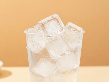 Bright high-key photography of a premium pre-filled ice cup sweating with condensation under crisp summer sunlight, vibrant warm-toned background, 50mm lens