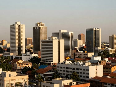 Expansive view of Accra's modern city center, architectural buildings, warm sunlight, clean composition.