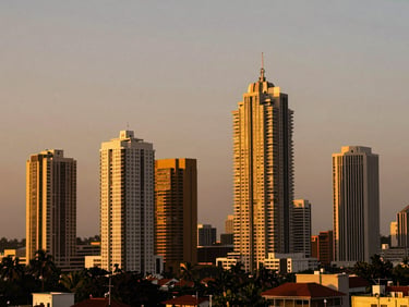 Wide-angle shot of the Lagos skyline at dusk, modern skyscrapers, golden hour light, rich saturated tones.