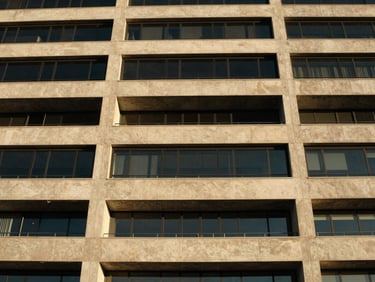 Architectural detail of a contemporary building in Cape Town, concrete and glass, high-contrast light, 35mm.