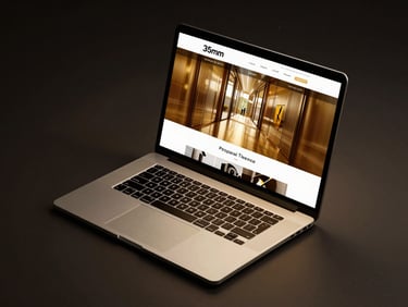 Isometric mockup of a luxury property website on a premium laptop, dramatic studio lighting, gold reflections, 35mm