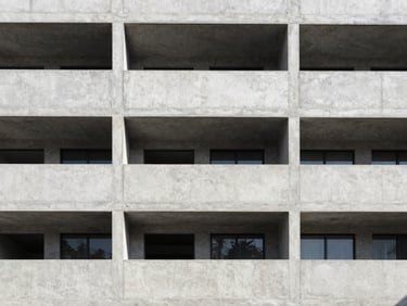 Modern concrete residential facade in Polanco, clean lines, architectural shadows, bright daylight