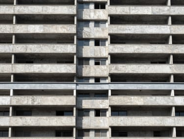 Symmetrical architectural elevation of a concrete and steel residential building in Colonia Juarez, bright natural daylight, 35mm