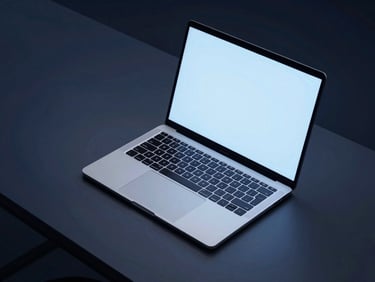 Geometric overhead shot of a modern minimalist workspace with a clean laptop and soft blue screen glow