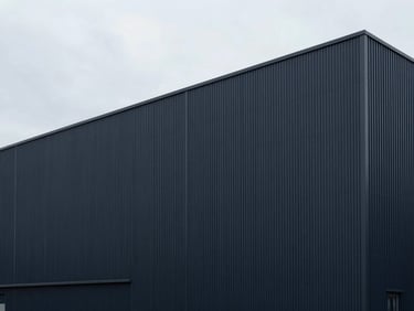 Architectural lines of a modern processing facility exterior, cool overcast daylight, geometric composition