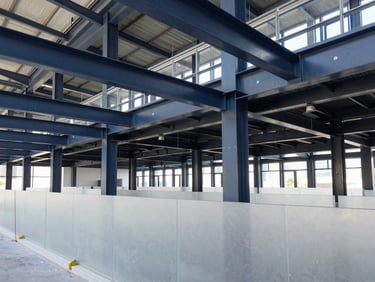 Modern corporate office interior undergoing precise architectural renovation, clean dust barriers, exposed steel beams, high contrast