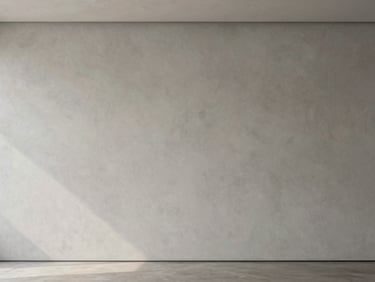 A light warm grey textured plaster wall in an empty modern gallery, elegant shadows