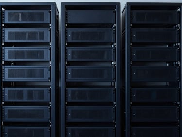 Minimalist workspace with structured server racks in background, cool lighting, sharp focus