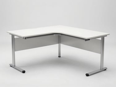 Straight-on product shot of a compact L-shaped corner desk, white melamine surface, silver aluminum legs, studio white background, bright even lighting, no people