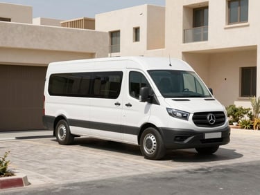 Branded transit vehicle parked in a clean Abu Dhabi residential driveway, bright natural daylight, crisp architectural lines