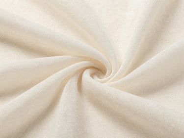 Close-up of a sheer wool-blend textile in soft off-white, showing the delicate weave and translucent quality.