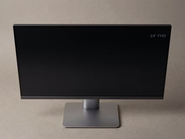 Overhead flat-lay of a 24-inch FHD monitor on a matte neutral surface, controlled studio lighting, bezel and port detail sharp, clean shadow, no lifestyle props