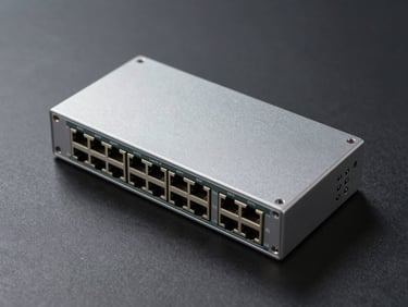 Overhead flat-lay of a 10G Layer 3 stackable switch on a neutral dark surface, SFP+ ports in focus, clean studio strobe, consistent color temperature, no lifestyle elements