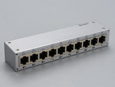 Direct overhead shot of a 24-port unmanaged gigabit Ethernet switch on a neutral grey surface, clean studio strobe lighting, all RJ45 ports visible, no labels or text