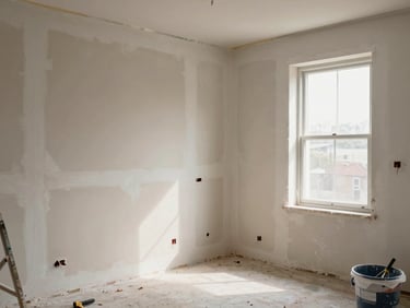 Corner vantage point of a room mid-renovation, plaster freshly applied on one wall, warm north-facing daylight from an open window, tools and buckets visible on the floor