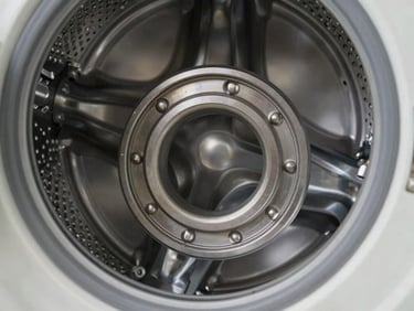 Macro shot of a clean, metallic washing machine drum bearing assembly, bright workshop lighting, technical detail.
