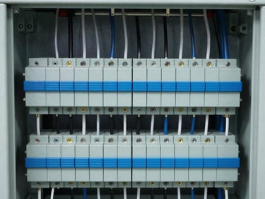 Detailed view of neatly organized terminal blocks and wiring inside a medium voltage switchgear cabinet, crisp focus, 35mm