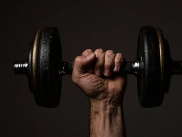 Close-up of a hand gripping a minimalist black dumbbell with subtle gold accents, dramatic side-lighting, deep shadows, 35mm, moody low-key photography