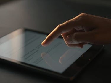Close-up of a hand adjusting a digital dashboard on a tablet, focused, warm golden-hour glow, shallow depth of field, 35mm, moody low-key photography