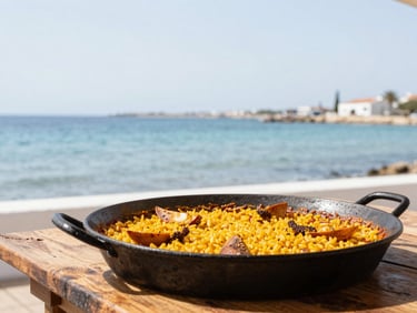 A traditional Spanish caldero rice dish served in a black iron pot on a rustic wooden table overlooking the blue Mar Menor lagoon, bright daylight