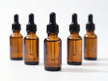 Small-batch organic apothecary bottles and botanical wellness goods on a bright white background, crisp natural lighting