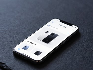 Minimalist tech photography, cool diffused studio lighting, dark slate and electric blue tones, macro depth of field showing an elegant e-commerce product page on a mobile screen.