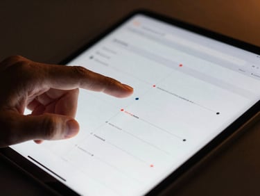 Tight macro-focused detail of hands interacting with a high-end tablet displaying clean structured UI mockups of automated workflows, dramatic lighting, photorealistic 35mm.