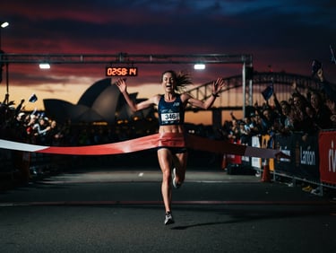 High-contrast action shot of a marathon runner crossing a Sydney finish line under dramatic twilight sky, 35mm lens.