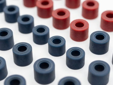 Organized custom industrial rubber components, precise molded edges, clean technical lighting.