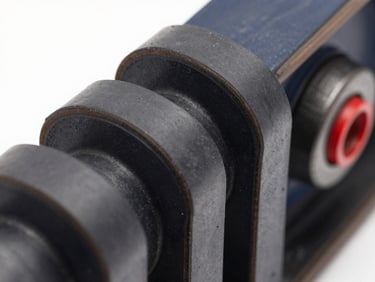 Macro shot of a heavy-duty industrial V-belt, reinforced rubber texture, technical-grade precision, clean studio background.