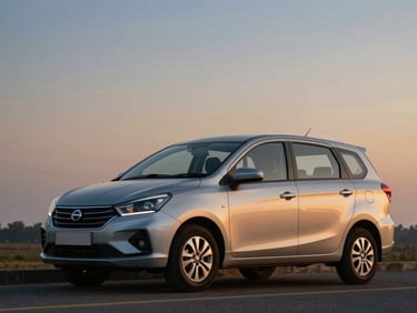A silver Maruti Ertiga parked under a soft twilight sky, highlighting its clean modern lines and spacious cabin