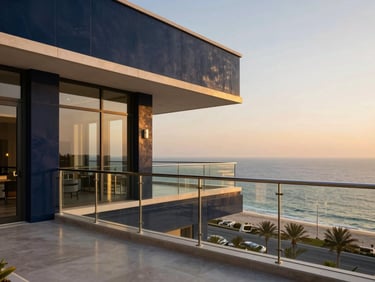 Modern luxury penthouse balcony overlooking Ras Al Khaimah coastline, golden hour, elegant glass railings