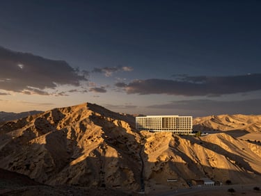 Strategic mountain-view land plot in Jebel Jais, dramatic twilight sky, architectural rendering of potential build