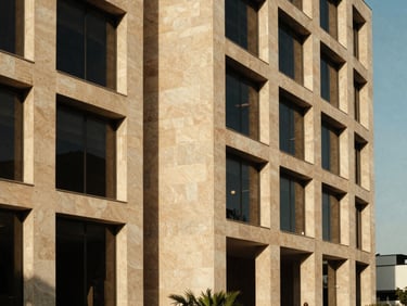 Clean architectural lines of a contemporary office building in San Pedro Garza Garcia, Monterrey, soft shadows, warm sandstone tones, medium format film.