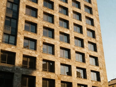 Architectural detail of a modern high-rise on Paseo de la Reforma, Mexico City, warm afternoon light, sandstone facade, medium format film.