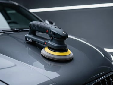 Sleek automotive photography of a machine polisher correcting clear coat defects under cool studio LED lighting