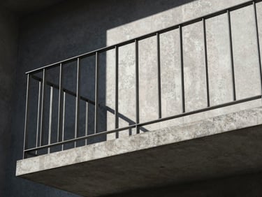 Modern minimalist steel railing on a concrete balcony, sharp architectural lines, raw industrial look, high contrast daylight