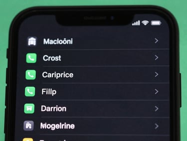 Macro shot of an Android device showing a clipboard manager app with a list of copied items, dark theme, subtle green highlights, clean interface.