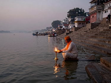Wide shot of pre-dawn Haridwar ghat, lone priest performing aarti with brass lamp over dark Ganga water, diffused amber flame reflection on river surface, stone steps receding into mist